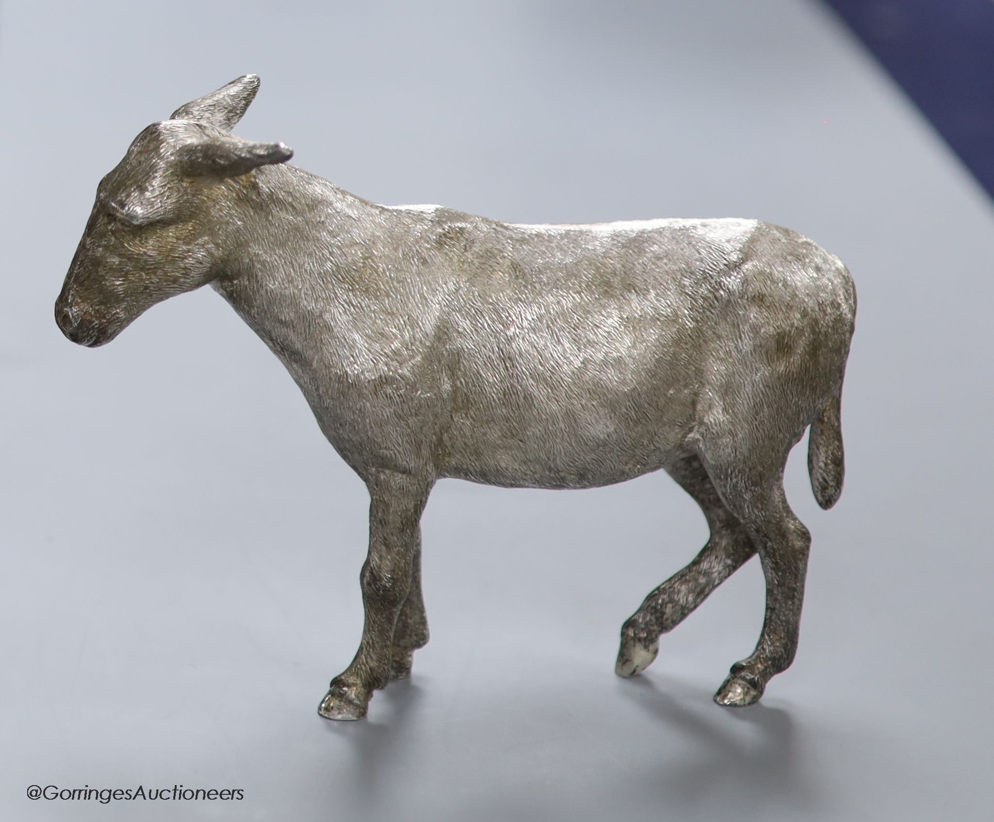 A 1960s' free standing silver miniature model of a donkey, Edward Barnard & Sons, London, 1964, height 12.5cm, 20.5oz.